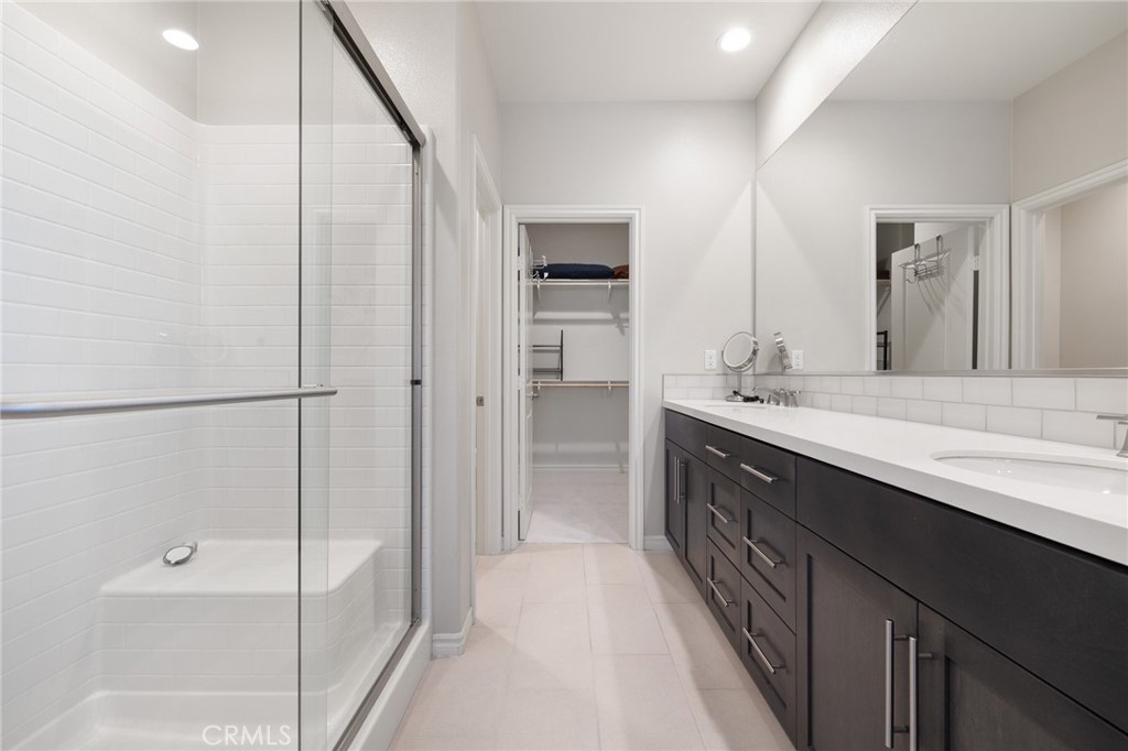 1200 Oliva Court Duarte, CA 91010 - Photo 24 of 40 a bathroom with a double vanity sink and mirror