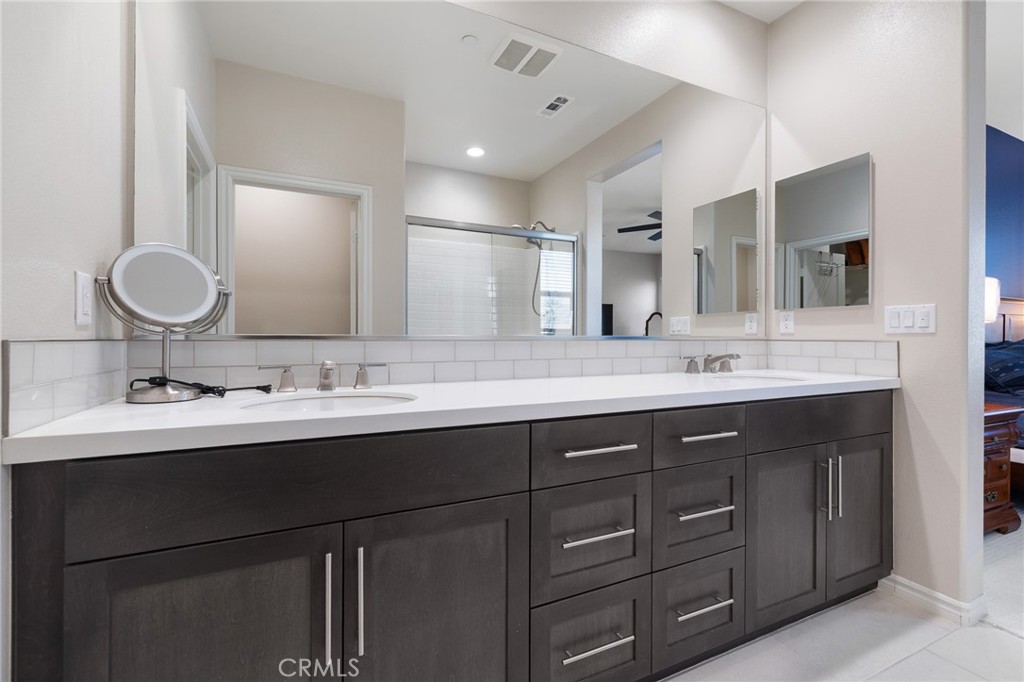 1200 Oliva Court Duarte, CA 91010 - Photo 27 of 40 a bathroom with a double vanity sink and a mirror