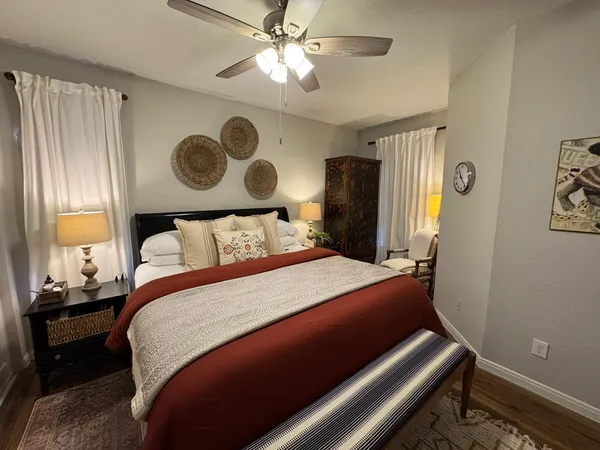 a bedroom with a bed and a window