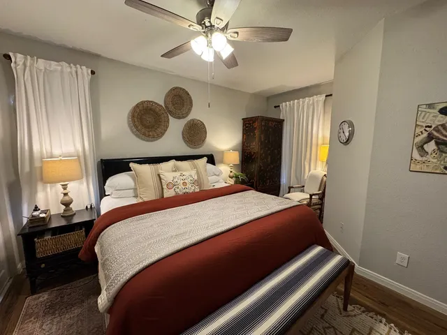 a bedroom with a bed and a window