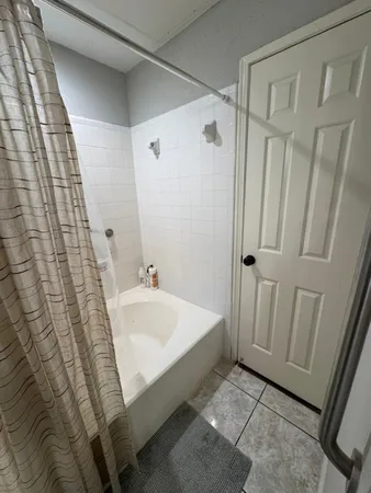 a bathroom with a sink a mirror and a shower