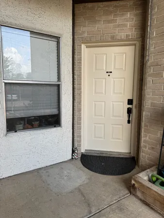 a view of a entryway door of the room