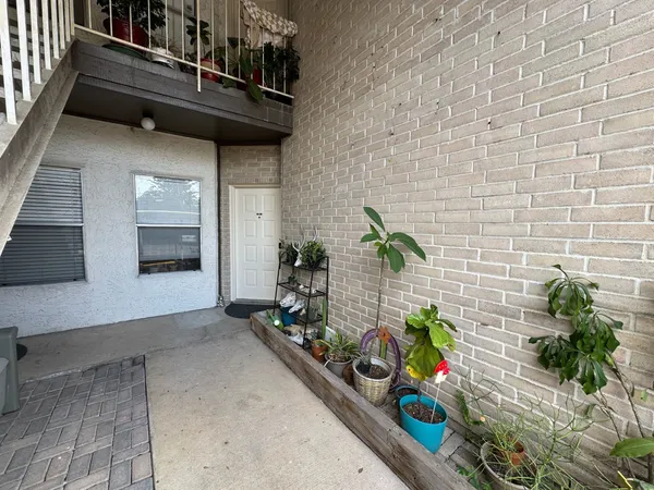 a view of entryway with flower pots