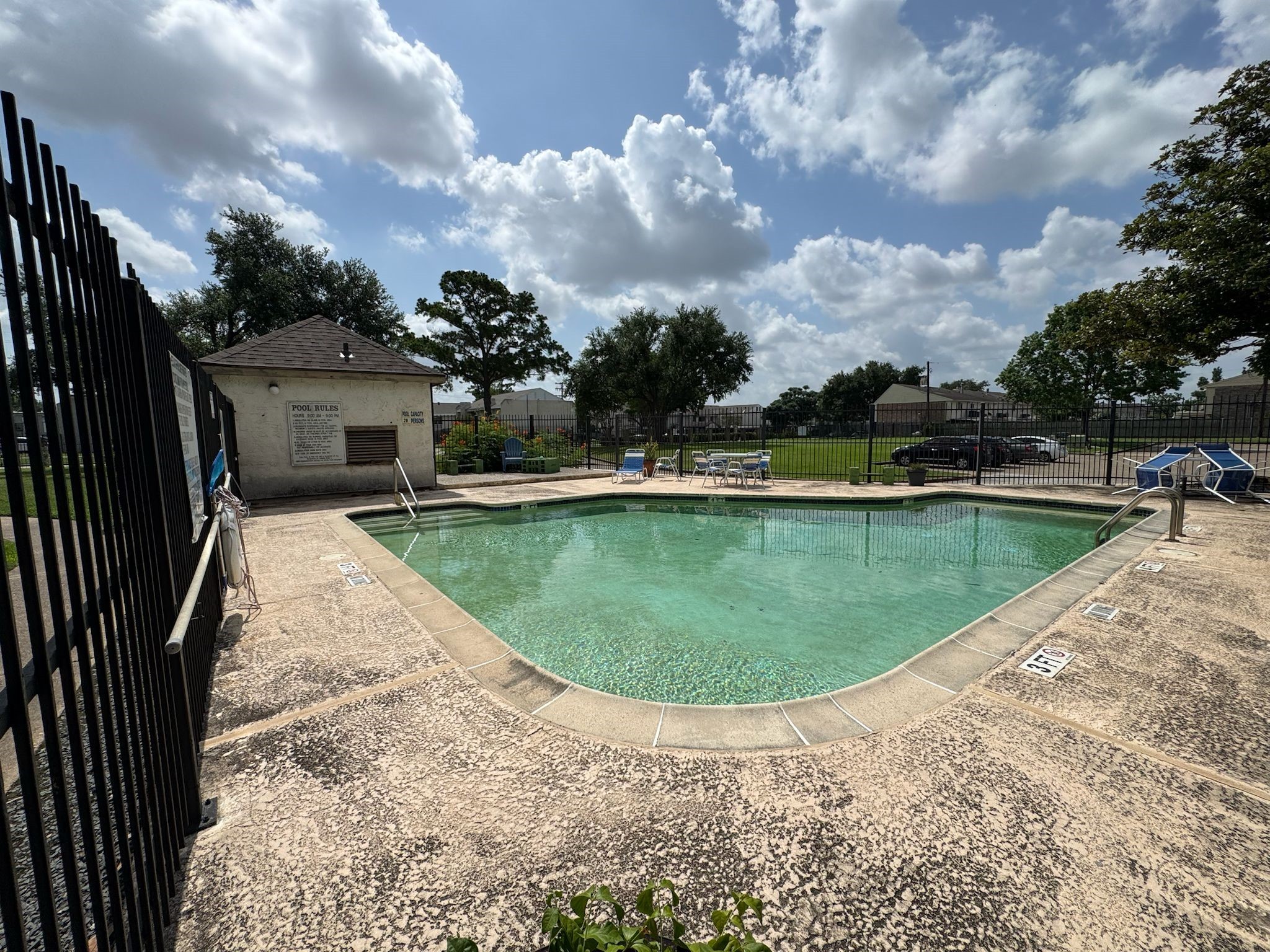 2011 Spenwick Drive, Unit 511 Houston, TX 77055 - Photo 34 of 37 a view of a swimming pool with a yard