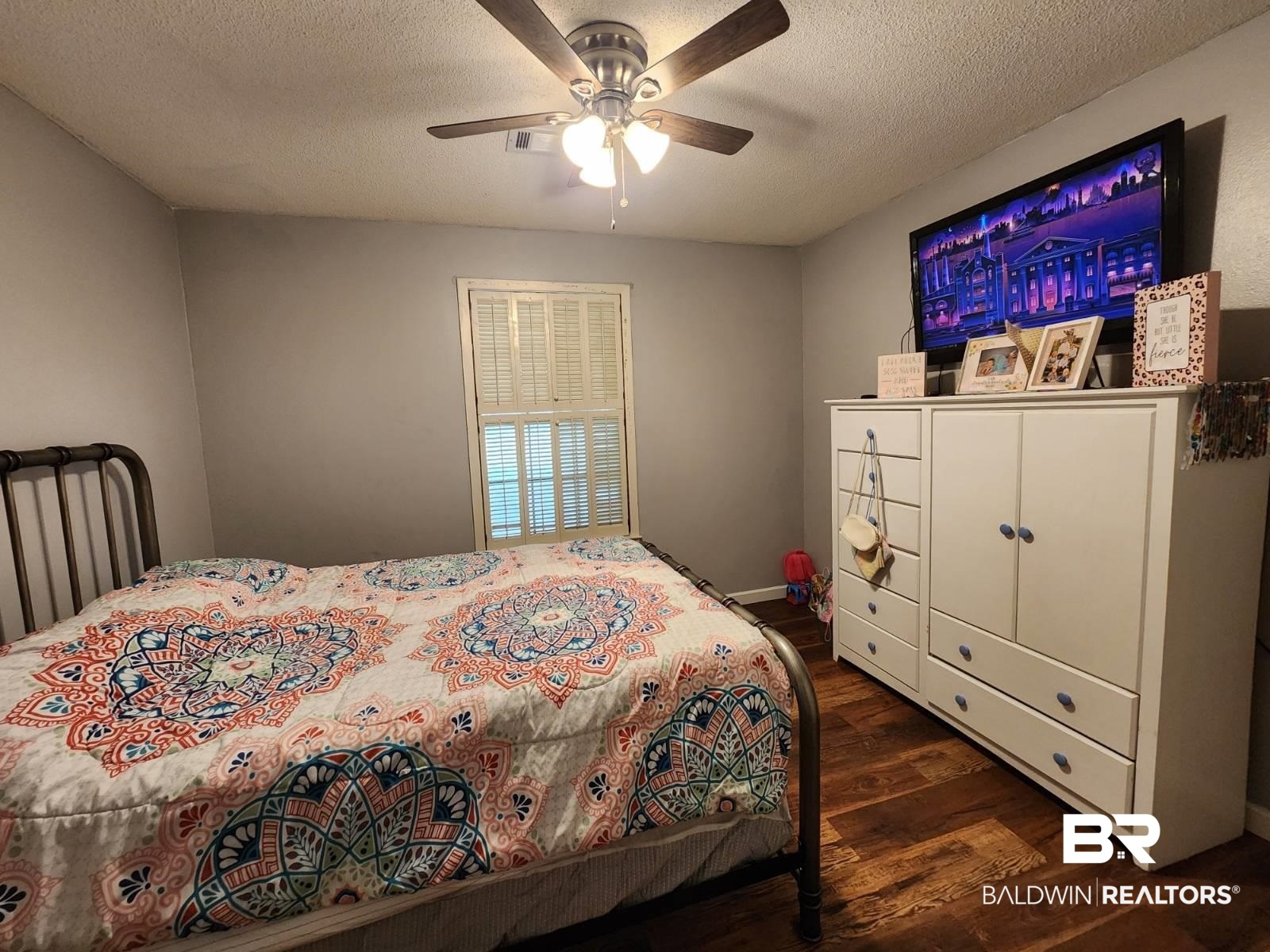 640 Horseshoe Road Brewton, AL 36426 - Photo 12 of 22 Bedroom with a textured ceiling, ceiling fan, and wood-type flooring