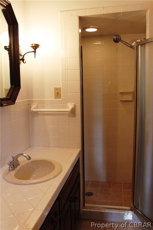 7449 Joseph Lewis Road Hayes, VA 23072 - Photo 28 of 32 Master bath with fully tiled, walk in shower and tile vanity top.