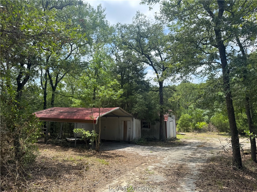 3518 Winding Road Hearne, TX 77859 - Photo 7 of 21 Carport with asphalt parking surface near entrance