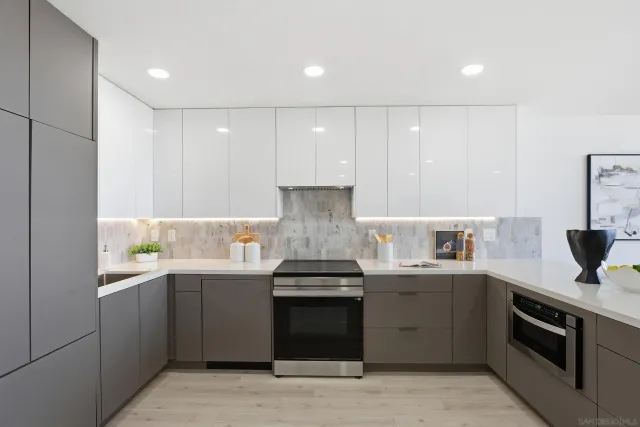 a living room with furniture kitchen and a table
