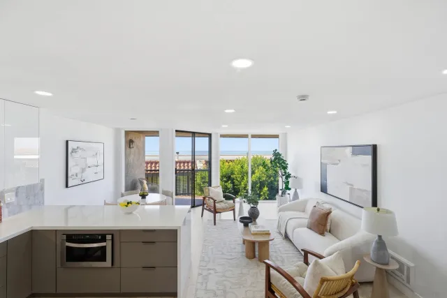 a kitchen with stainless steel appliances kitchen island granite countertop a stove and a sink