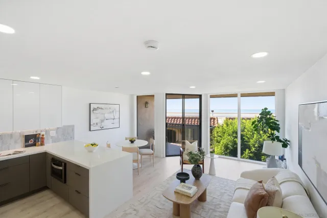 a kitchen with stainless steel appliances kitchen island granite countertop a sink and cabinets