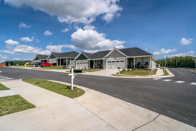 a swimming pool with outdoor seating yard and barbeque oven
