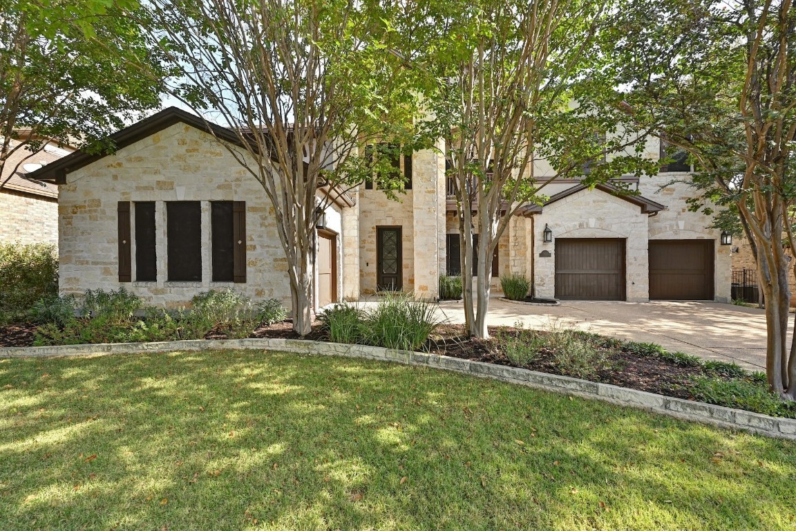 10729 Canfield Drive Austin, TX 78739 - Photo 1 of 1 front view of a house with a yard