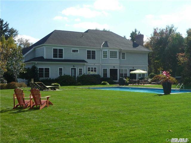 501 Cold Spring Road Laurel Hollow, NY 11791 - Photo 1 of 1 a front view of house with yard and green space