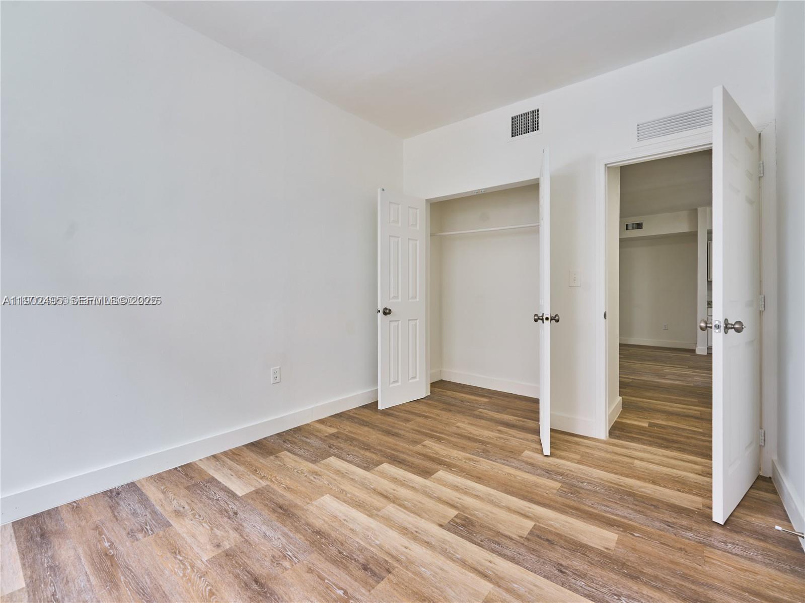 6211 Northwest 7th Avenue, Unit 4 Miami, FL 33150 - Photo 2 of 9 wooden floor in an empty room