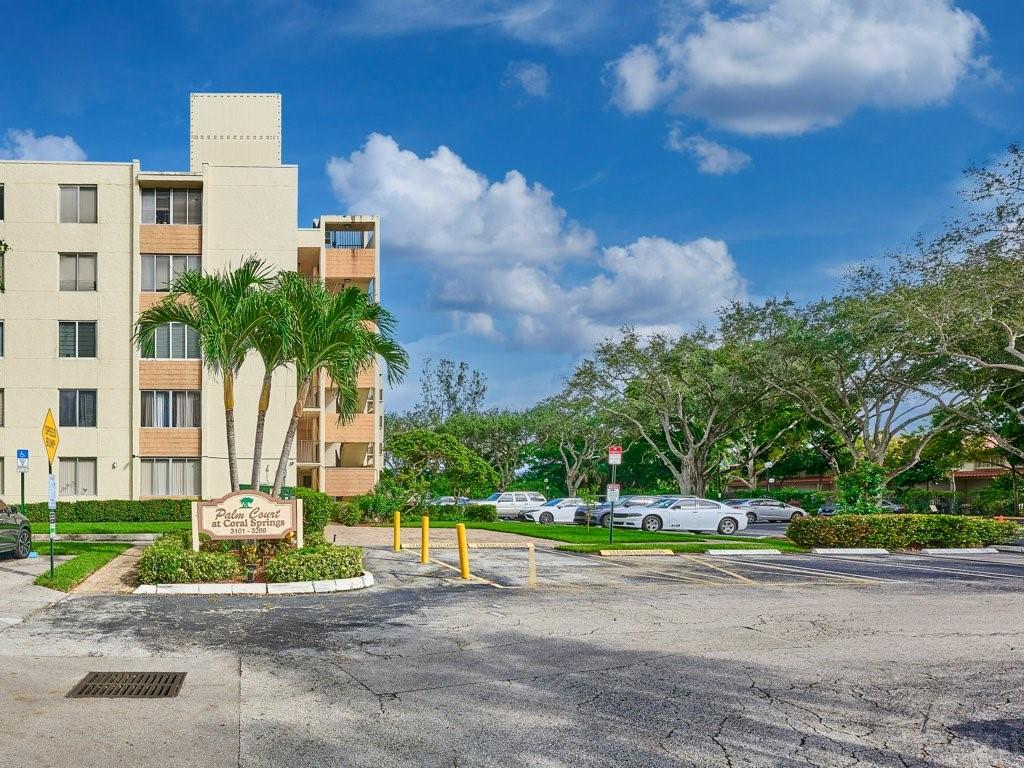 a front view of a building with garden