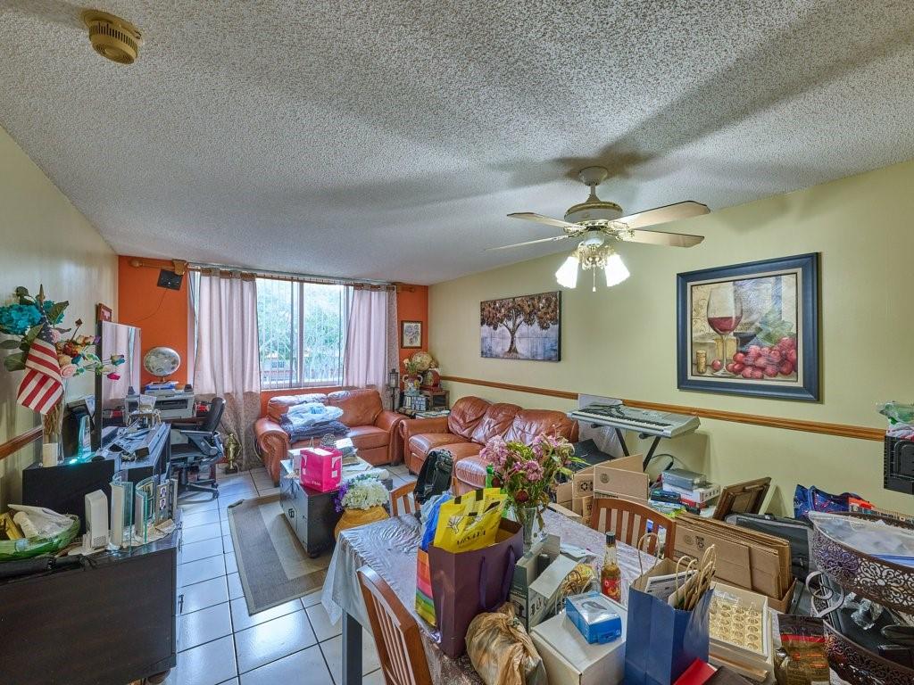 3253 Riverside Drive, Unit D301 Coral Springs, FL 33065 - Photo 20 of 29 a living room filled with furniture