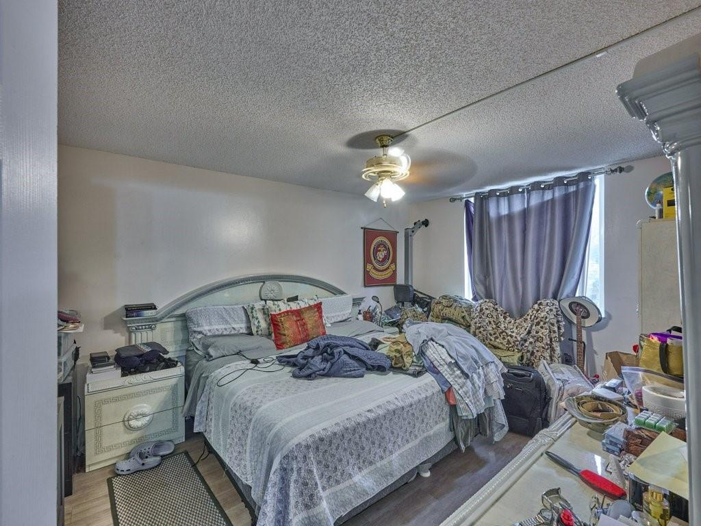 3253 Riverside Drive, Unit D301 Coral Springs, FL 33065 - Photo 22 of 29 a bed room with a bed and a window