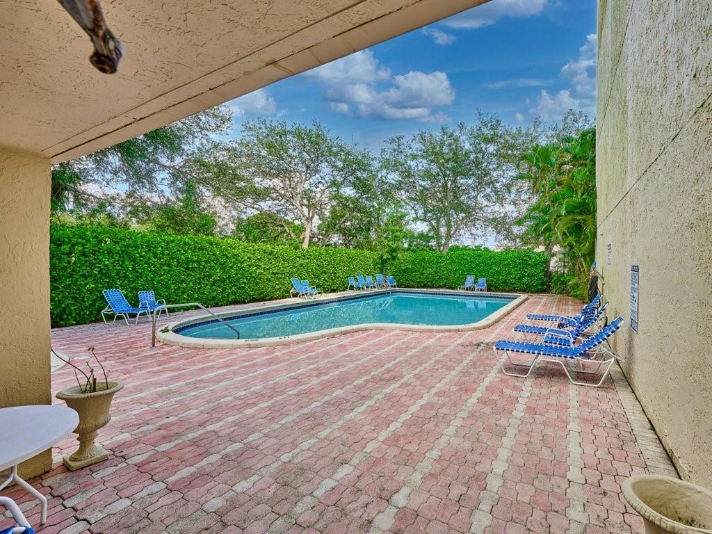 3253 Riverside Drive, Unit D301 Coral Springs, FL 33065 - Photo 28 of 29 a view of swimming pool with lounge chair