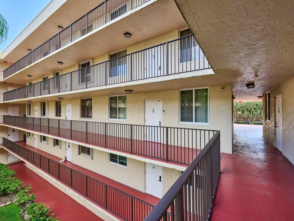 3253 Riverside Drive, Unit D301 Coral Springs, FL 33065 - Photo 6 of 29 a view of a balcony with large windows