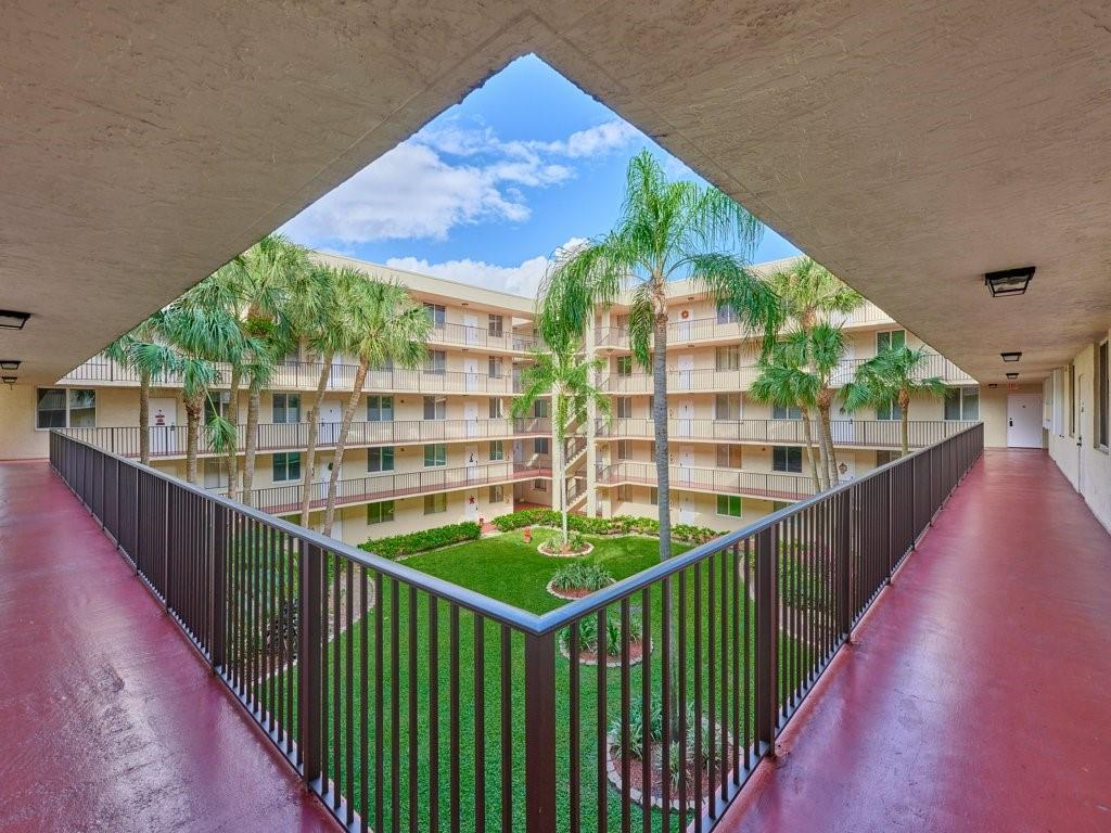 3253 Riverside Drive, Unit D301 Coral Springs, FL 33065 - Photo 7 of 29 a view of balcony with wooden floor