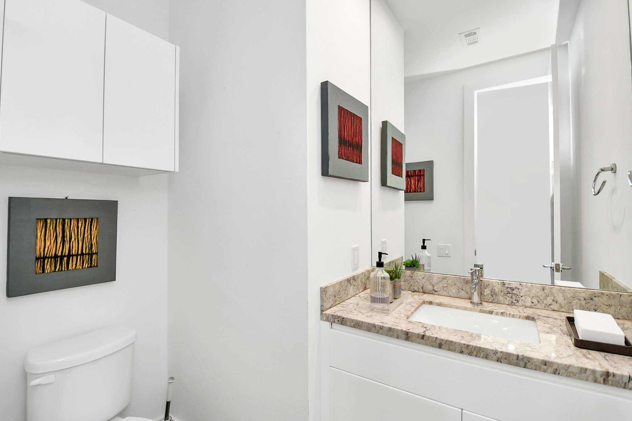 4722 Austin Street Houston, TX 77004 - Photo 16 of 38 2nd floor half-bath is conveniently located at the top of the stair landing.
