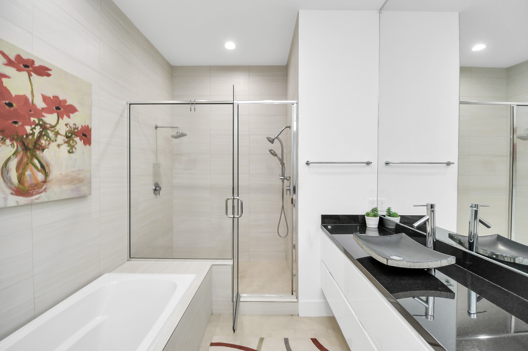 4722 Austin Street Houston, TX 77004 - Photo 21 of 38 a bathroom with a granite countertop sink a mirror and a bathtub