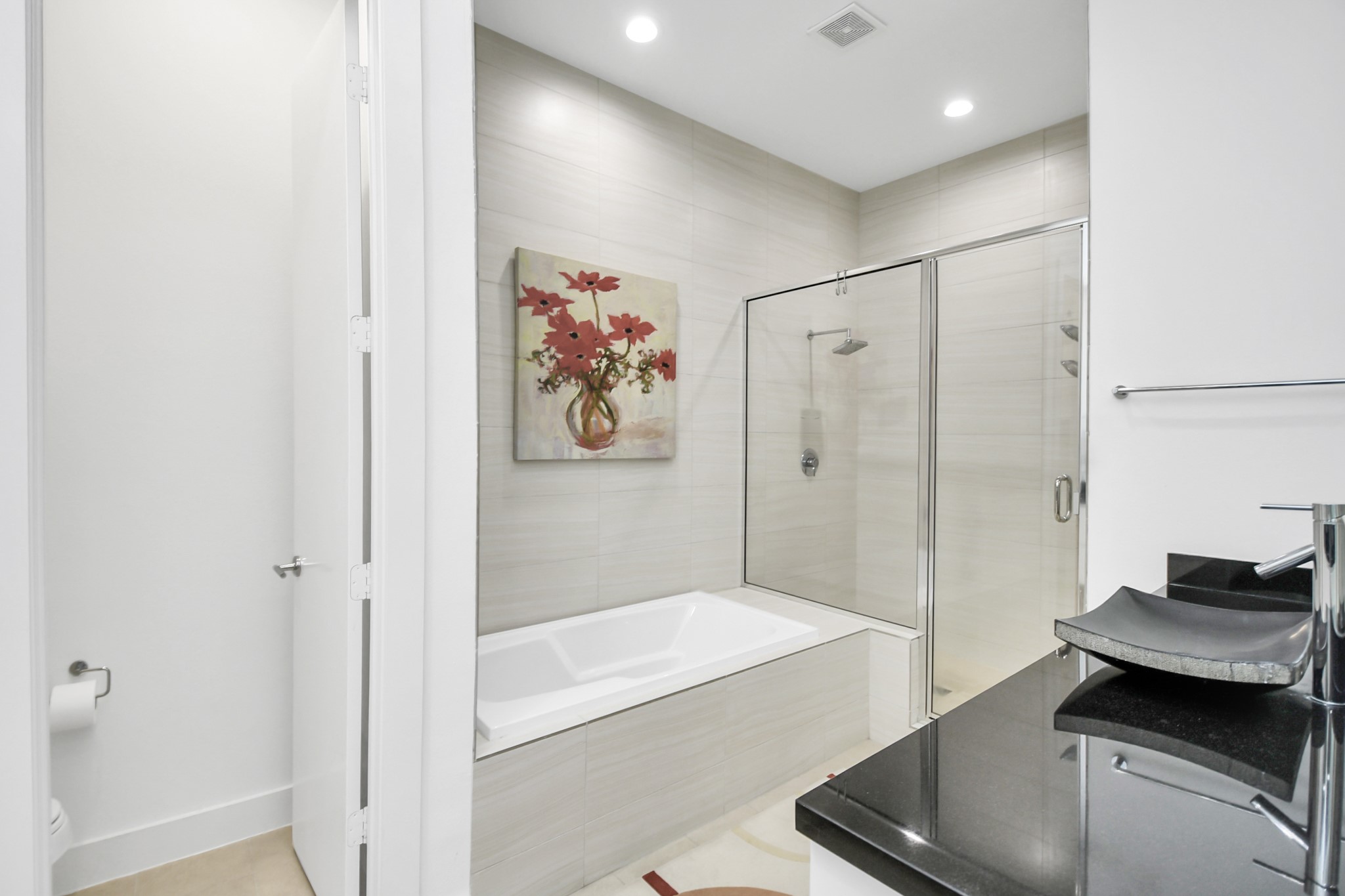 4722 Austin Street Houston, TX 77004 - Photo 24 of 38 a bathroom with a tub and a shower