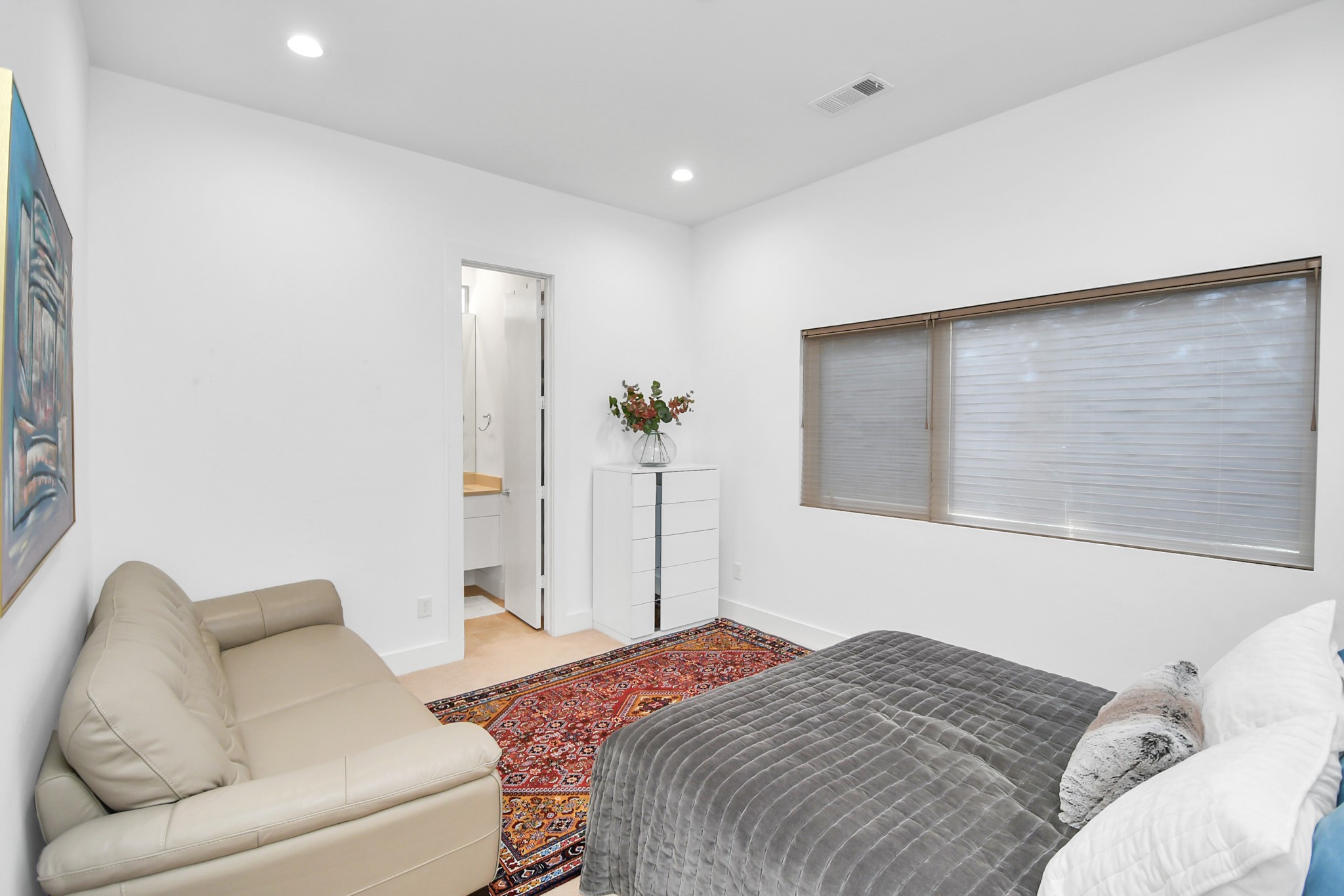 4722 Austin Street Houston, TX 77004 - Photo 25 of 38 a bedroom with a bed couch and a window
