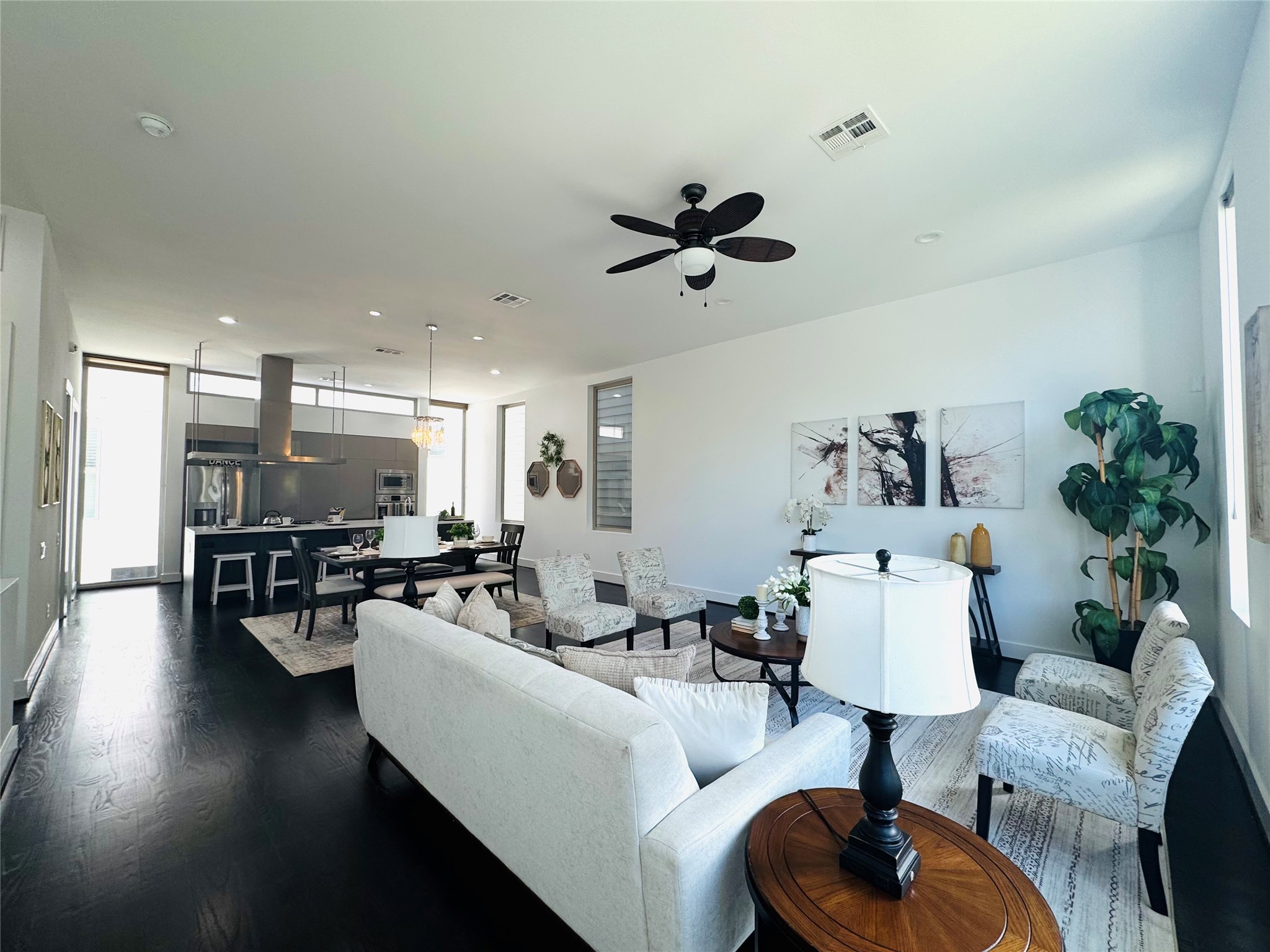 4722 Austin Street Houston, TX 77004 - Photo 9 of 38 Absolute definition of open concept living awaits on the 2nd floor! Soaring ceilings, recessed lighting, beautiful hardwood floors and more! (professional staging)