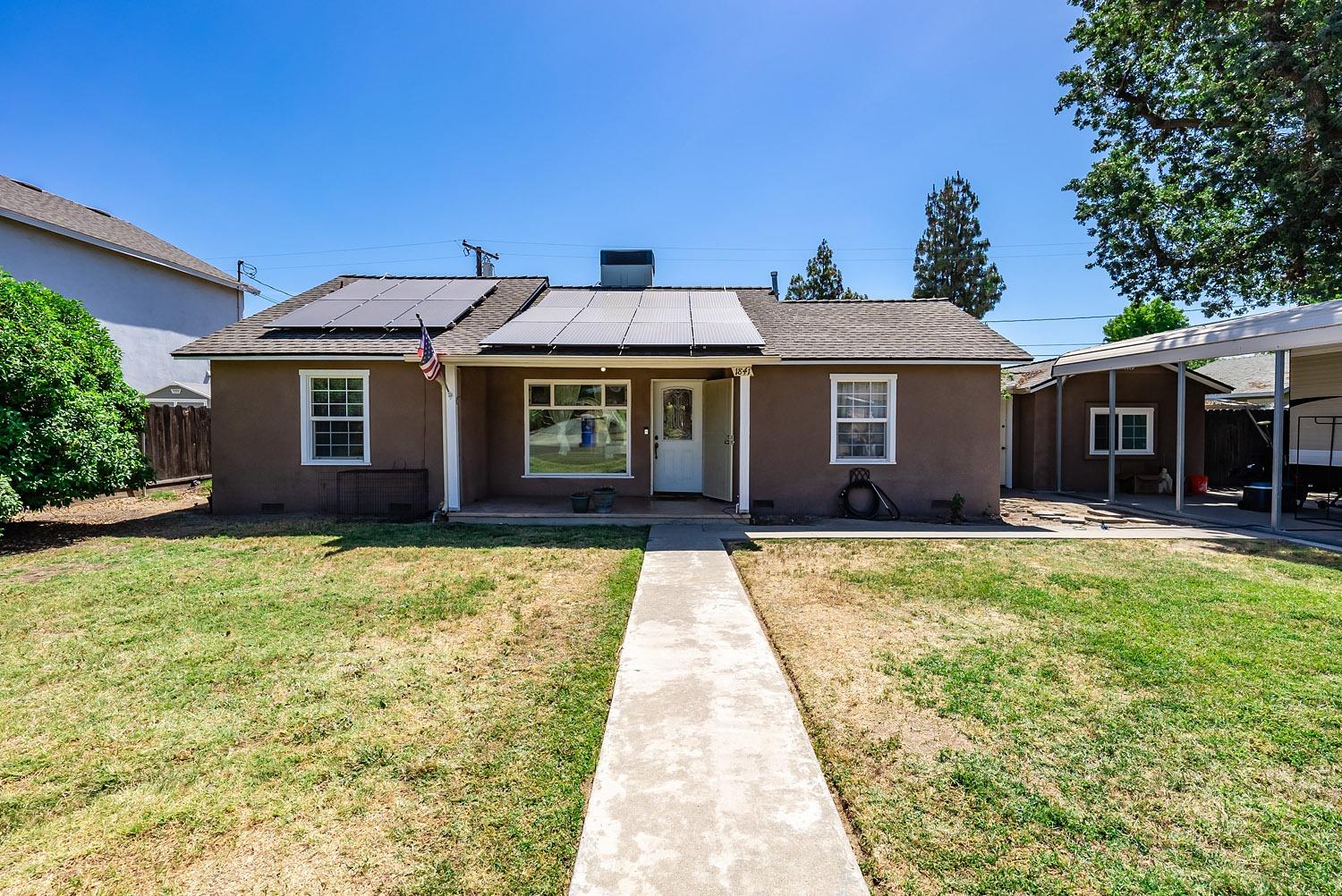 1841 Easy Street Hanford, CA 93230 - Photo 1 of 16 a front view of a house with a yard