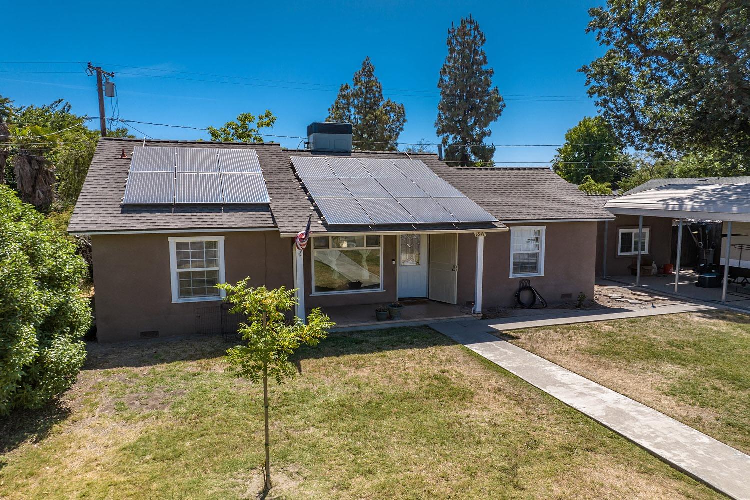 1841 Easy Street Hanford, CA 93230 - Photo 2 of 16 a view of a house with table and chairs in a patio