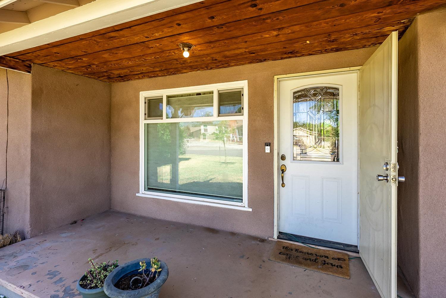 1841 Easy Street Hanford, CA 93230 - Photo 3 of 16 a view of an empty room with a window
