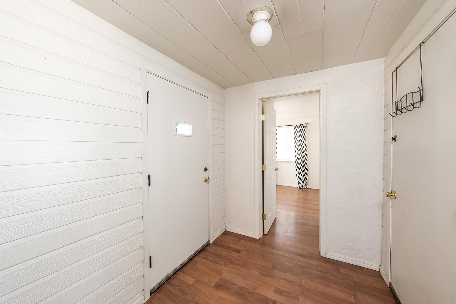 1841 Easy Street Hanford, CA 93230 - Photo 10 of 16 a view of a hallway with wooden floor