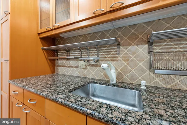 a kitchen with a sink and refrigerator