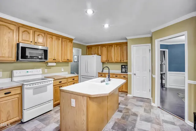 a kitchen with a sink stove and refrigerator