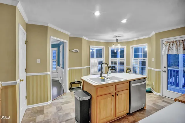 a room with sink a washer and dryer