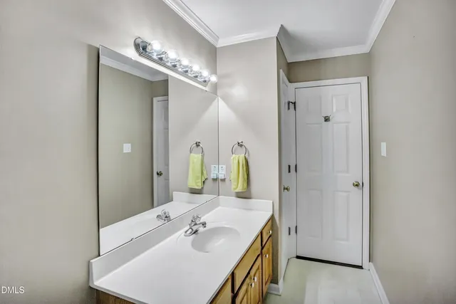 a bathroom with a sink tub and a mirror