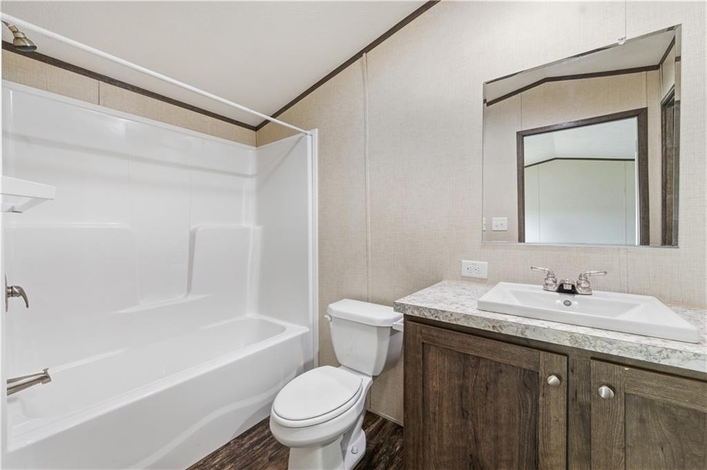 130 Brook Lane Valencia, PA 16059 - Photo 11 of 16 a bathroom with a granite countertop sink toilet and shower