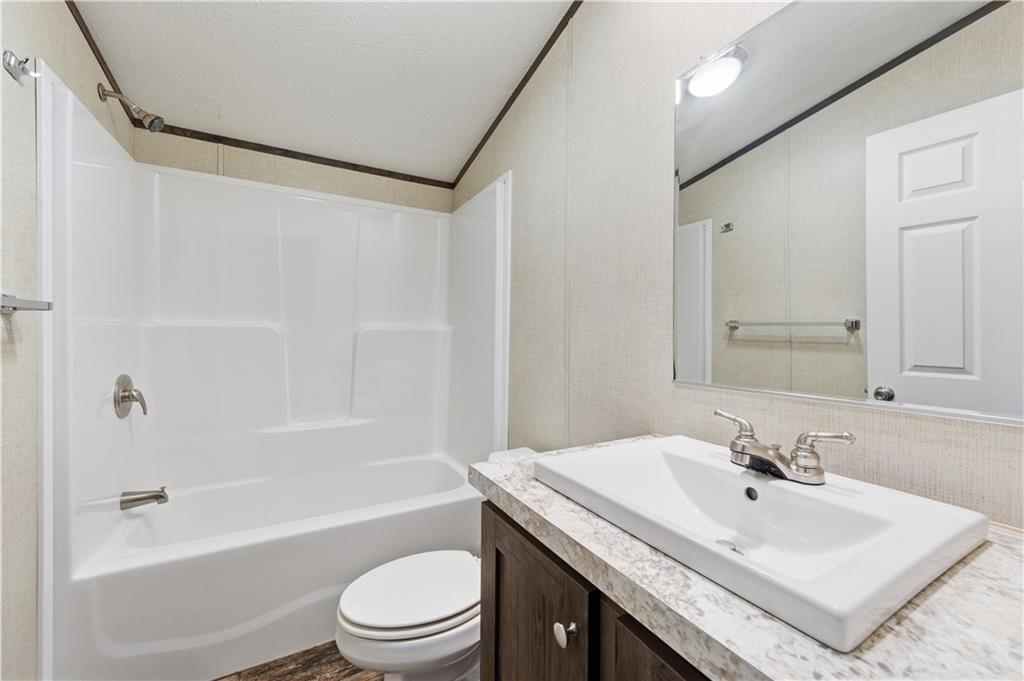 130 Brook Lane Valencia, PA 16059 - Photo 14 of 16 a bathroom with a sink a toilet and a bathtub