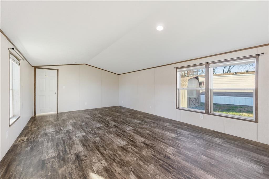 130 Brook Lane Valencia, PA 16059 - Photo 7 of 16 a view of a big room with wooden floor and windows