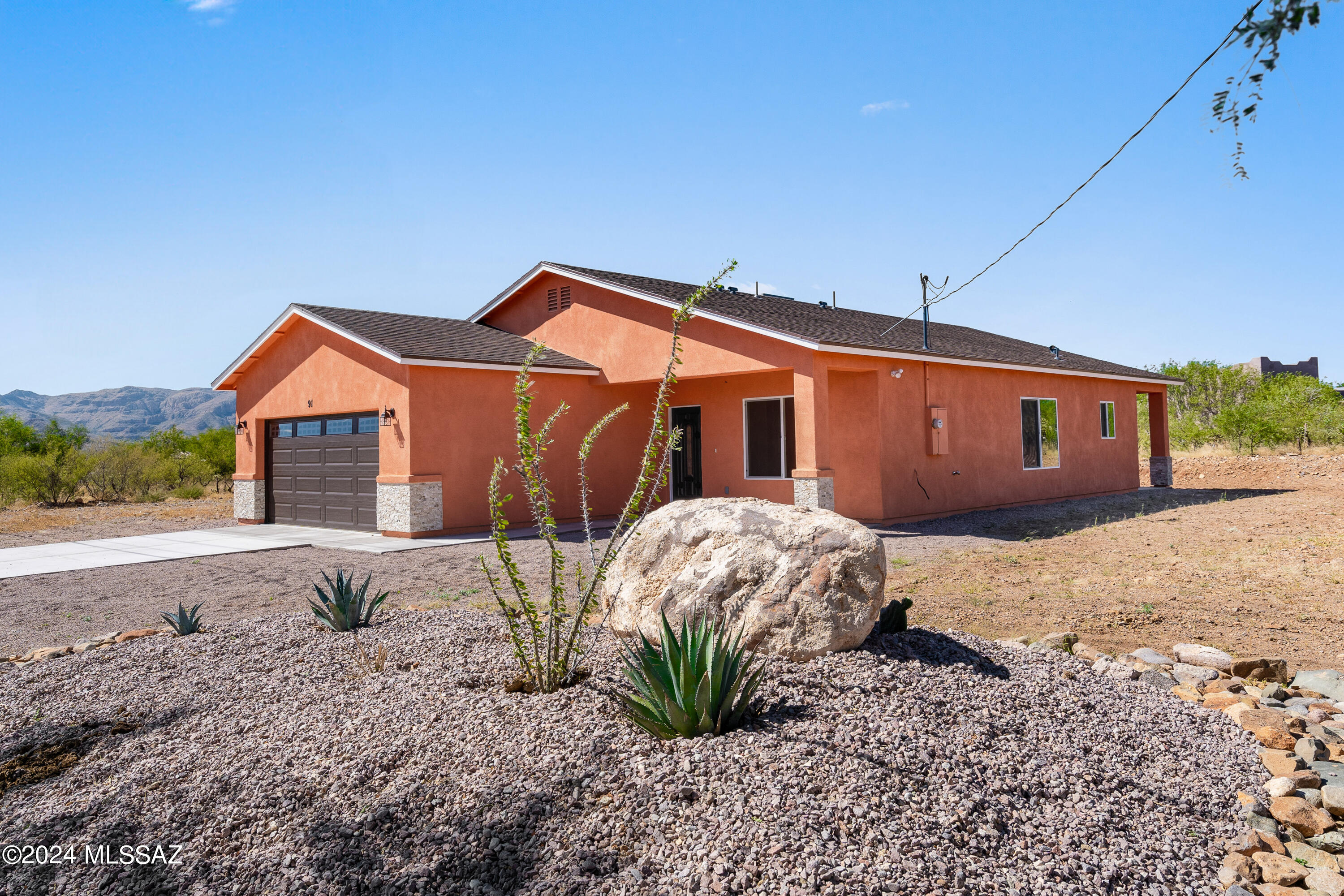 91 Avenida De Las Naciones Rio Rico, AZ 85648 - Photo 1 of 36 a backyard of a house with table and chairs