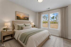 2760 River Meadow Spring Hope, NC 27882 - Photo 5 of 42 a bedroom with a bed and a window