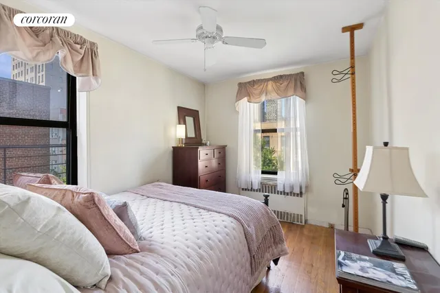 a living room with furniture a rug and a large window