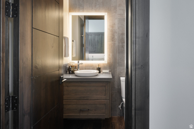 11547 Soaring Hawk Lane Hideout, UT 84036 - Photo 20 of 43 Modern vanity featuring a vessel sink, integrated LED mirror, and built-in storage