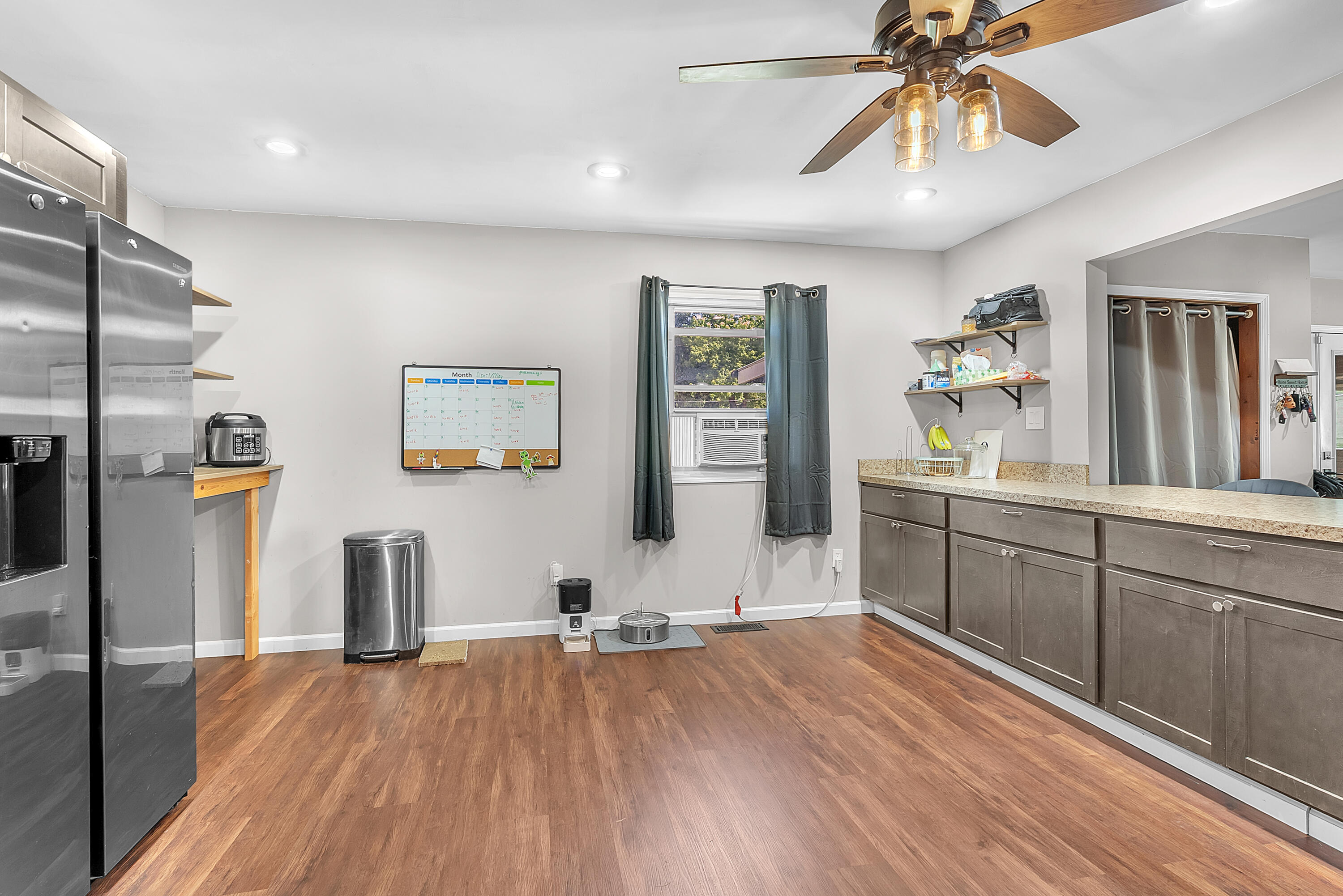 719 Capitol Road Valparaiso, IN 46385 - Photo 6 of 37 a view of a kitchen with a sink cabinet window and wooden floor