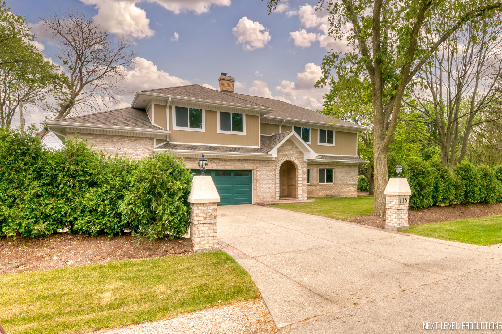 115 Birch Avenue Lake Bluff, IL 60044 - Photo 1 of 39 a front view of a house with a yard and garage