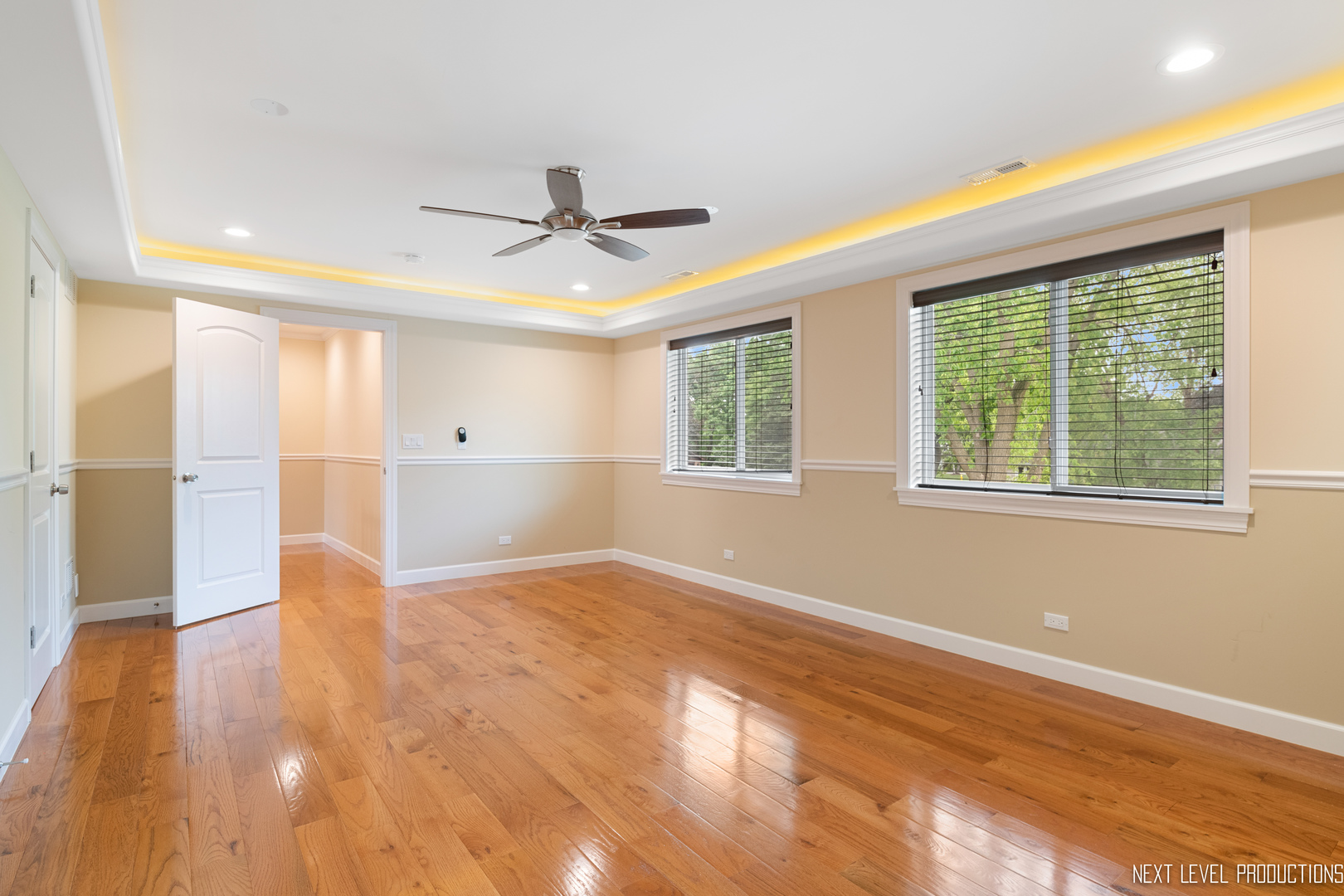 115 Birch Avenue Lake Bluff, IL 60044 - Photo 18 of 39 a view of an empty room with a window and wooden floor