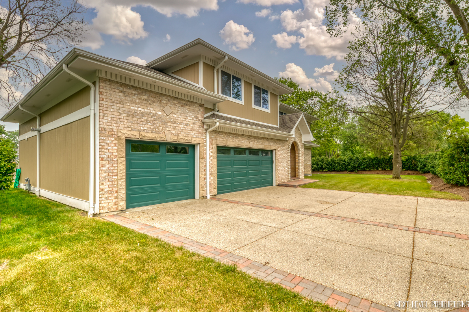115 Birch Avenue Lake Bluff, IL 60044 - Photo 3 of 39 a front view of a house with a yard and garage