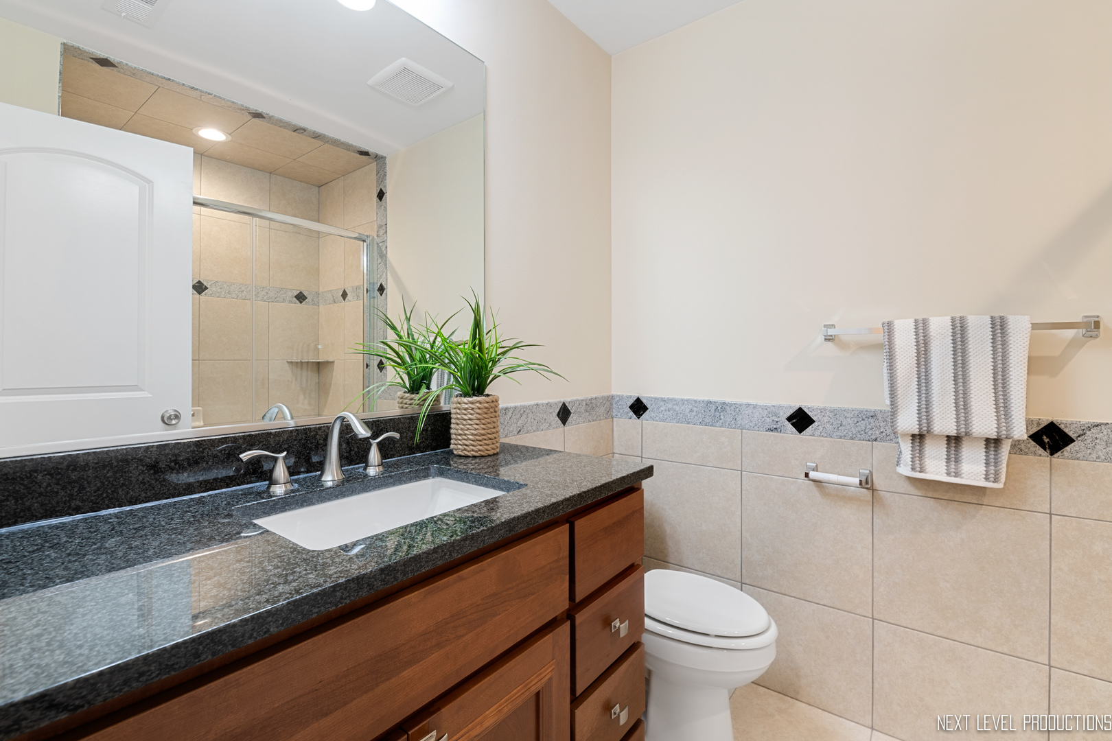 115 Birch Avenue Lake Bluff, IL 60044 - Photo 22 of 39 a bathroom with a granite countertop toilet sink and mirror
