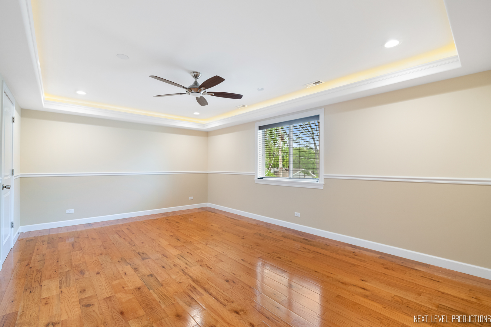 115 Birch Avenue Lake Bluff, IL 60044 - Photo 25 of 39 an empty room with a window and a ceiling fan